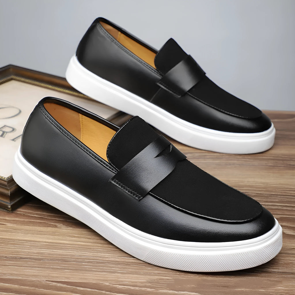 Black men's slip-on casual shoes with tassel detailing and a round toe