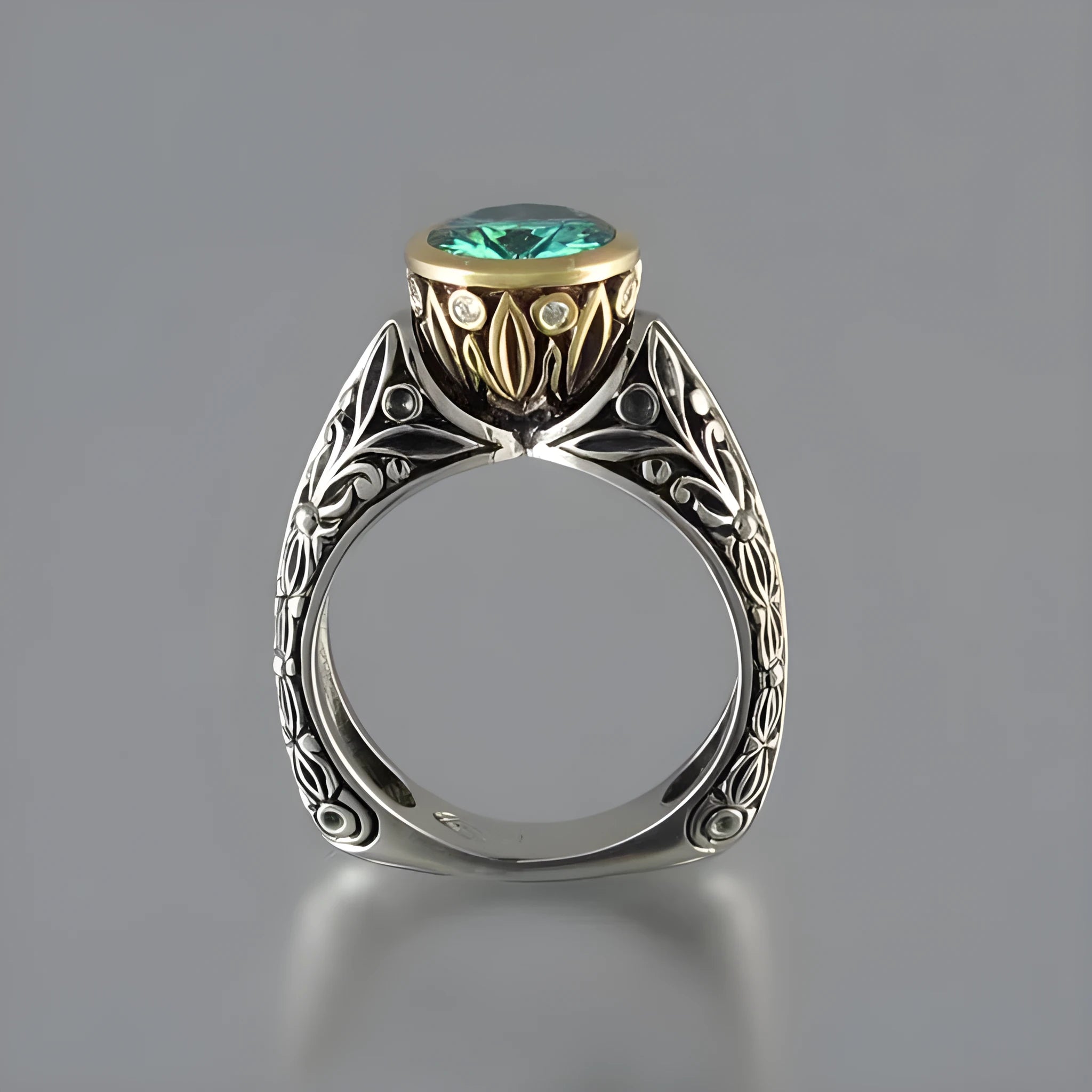 Gold-plated flower-shaped vintage ring with green gemstone and colour separation detailing