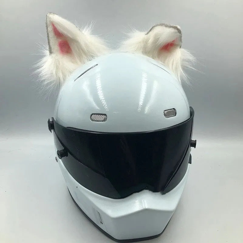Set of black and white wolf ear and tail ornaments clipped to a motorcycle helmet