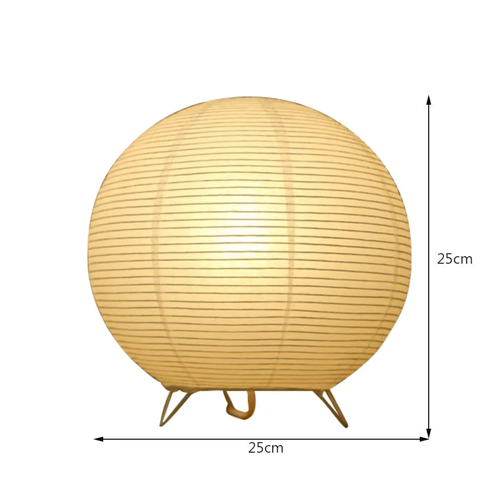 White rice paper table lamp with traditional handwork on bedside table