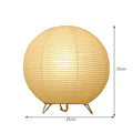 White rice paper table lamp with traditional handwork on bedside table