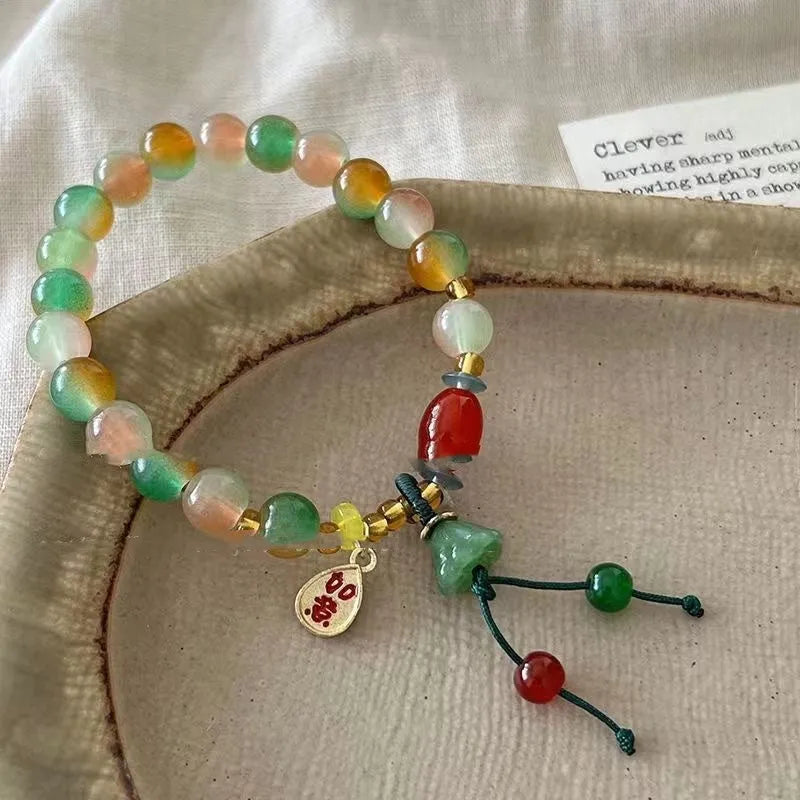 M990 Lotus Ruyi bracelet showing mixed material construction and lotus motif with manual craft details