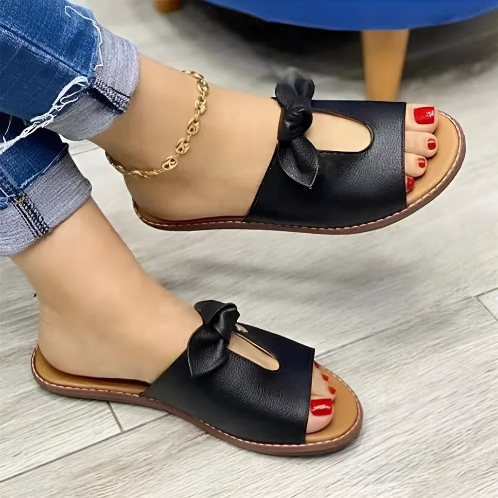 Ladies casual sandals with bow detailing on fish mouth slipper style in black, pink or gold colours