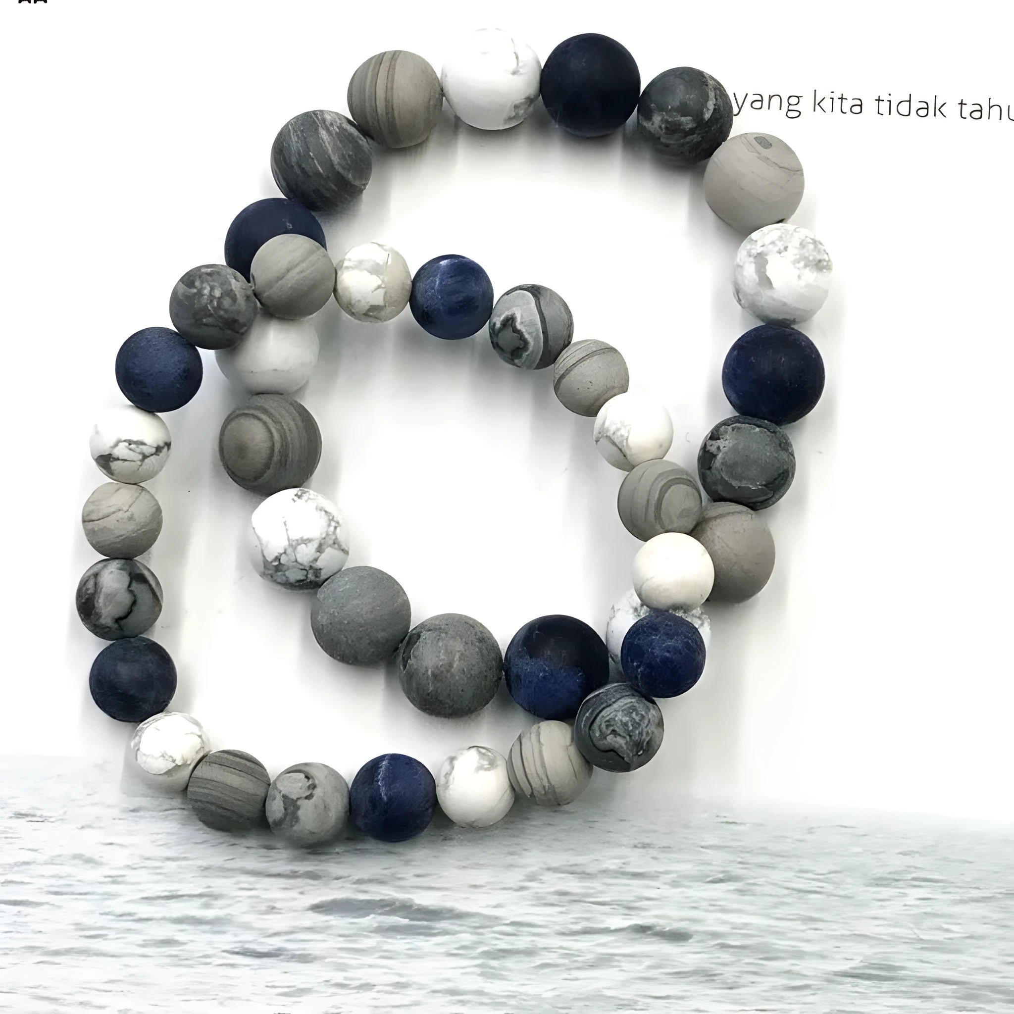 Handmade planet stone men's bracelet in U-shape, S228 Universe Wind design on wrist.