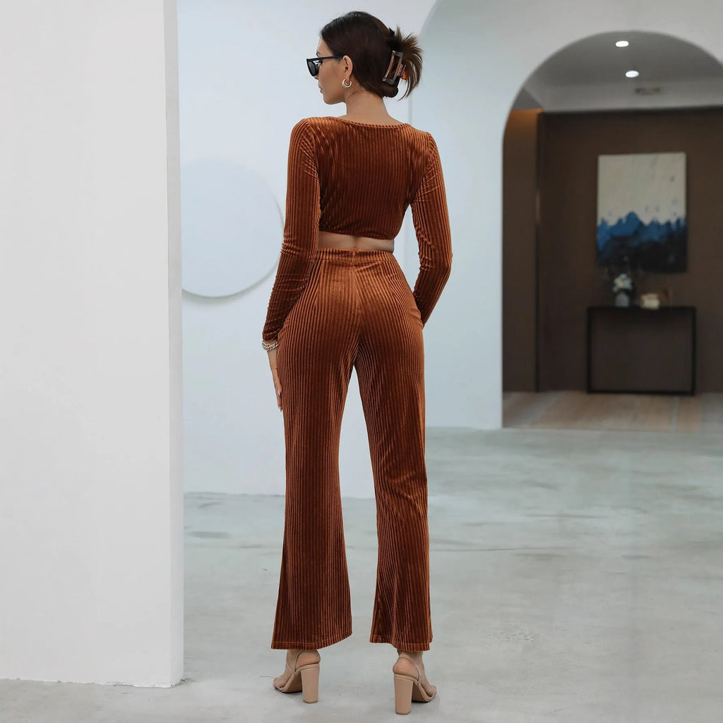 Caramel coloured long sleeve sweater and trouser set laid flat, showing casual two-piece design.