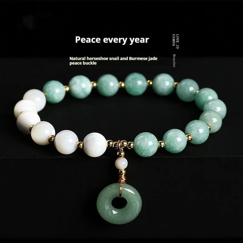 Women's Burma jade bracelet with copper horseshoe screw safety clasp showing 8mm round beads