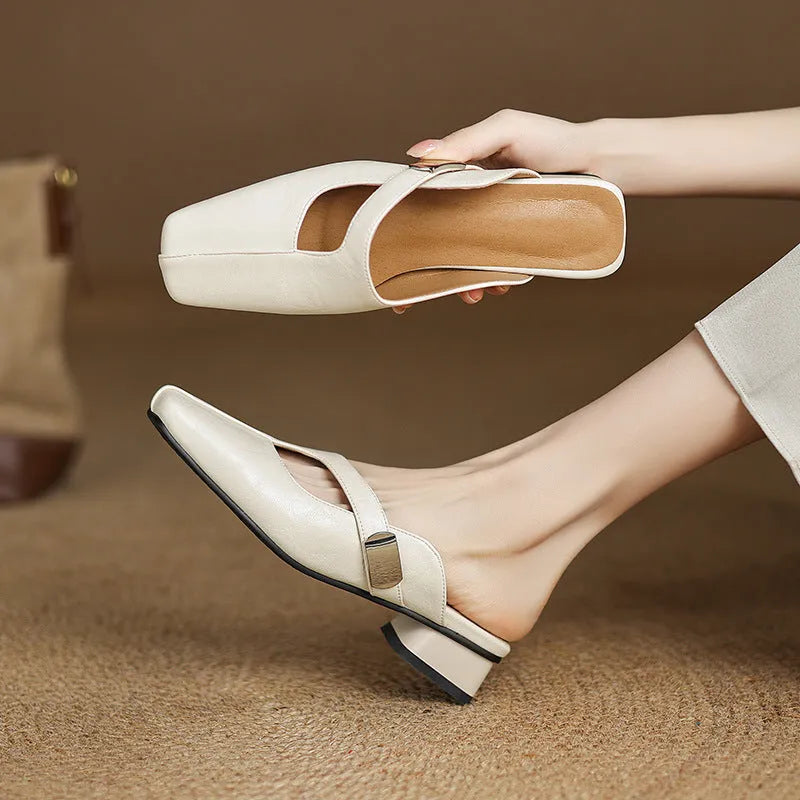 British style square toe outdoor slippers in beige with a low heel and rubber sole.