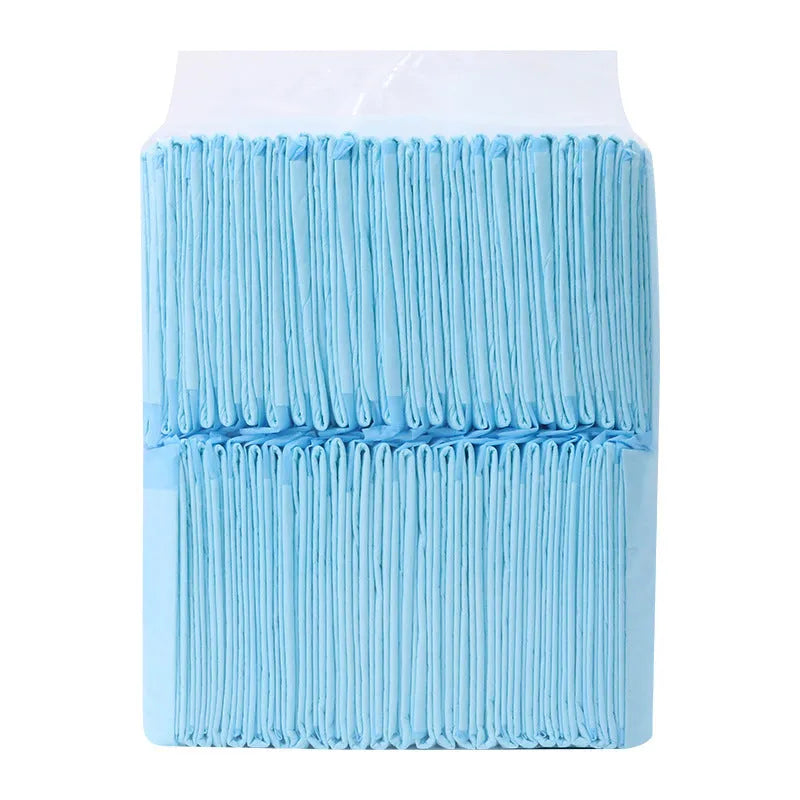 Pack of white pet urinal pads showing layered edge and bamboo charcoal variant, with size guide showing S M L XL dimensions.