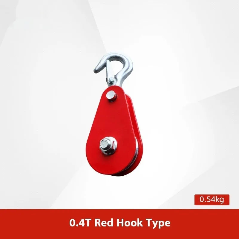 Red industrial steel lifting pulley with a safety latch on the hook for secure lifting.