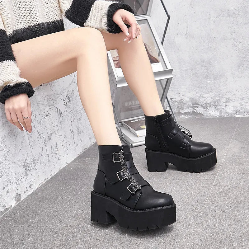 Black women's punk platform ankle boots with bat buckle and side zip.