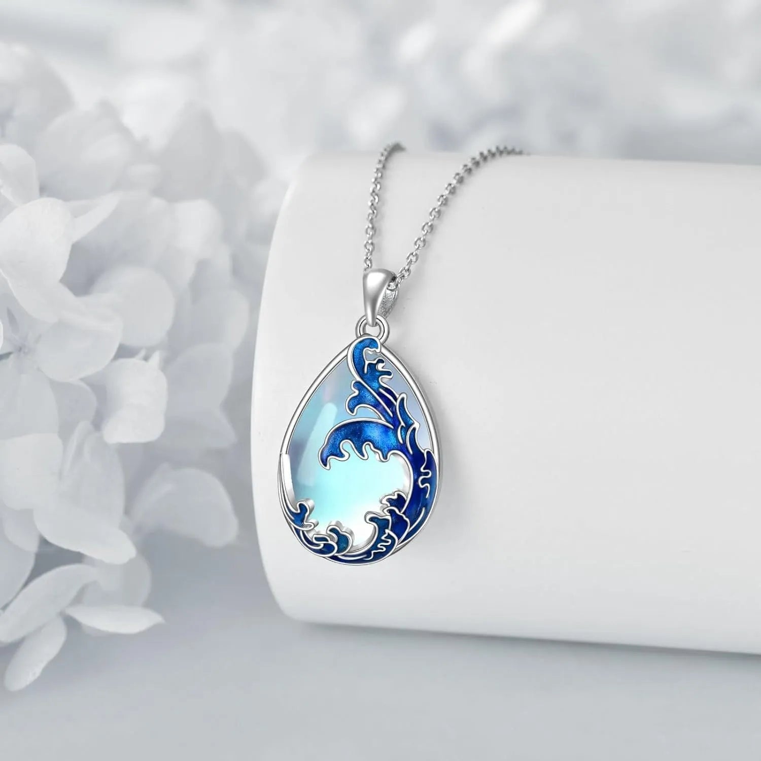 Moonstone blue alloy heart pendant on a women's necklace chain.