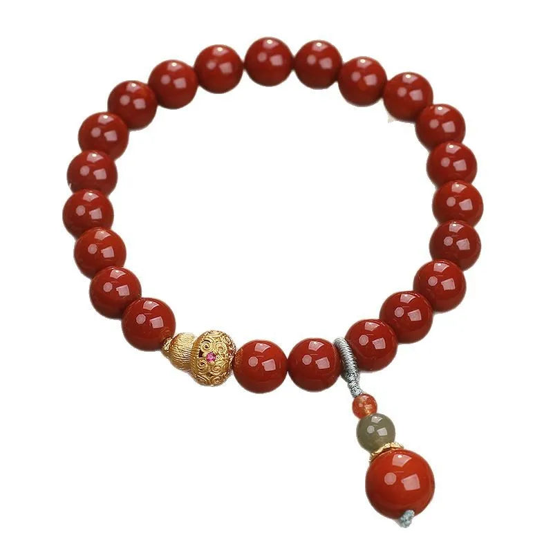 Red agate ethnic style bracelet for women on a plain background