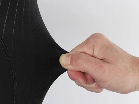 Black seven-inch cycling shorts with a shock-absorbing cushion, compression fit, and side pockets.