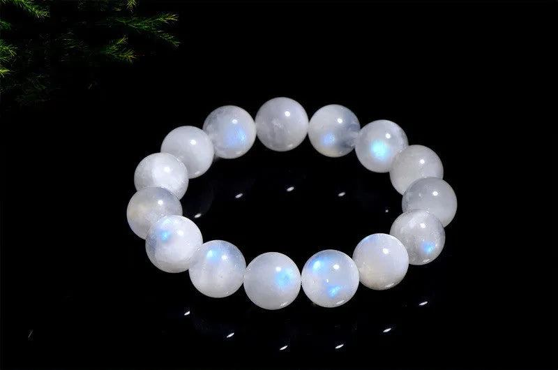 Natural blue moonlight round bead moonstone bracelet on a white background.
