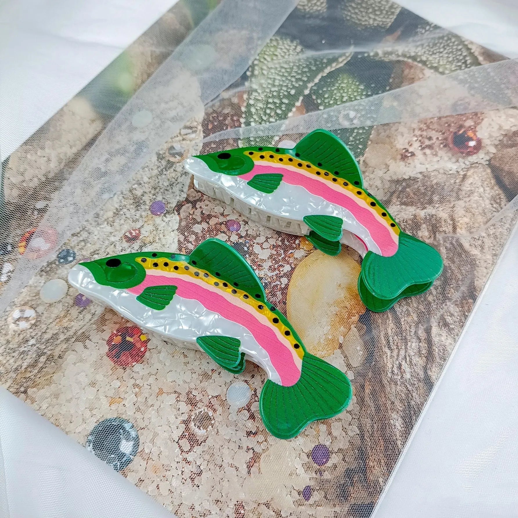 Dark green PVC hair clip with rainbow trout fish design inspired by carp elements