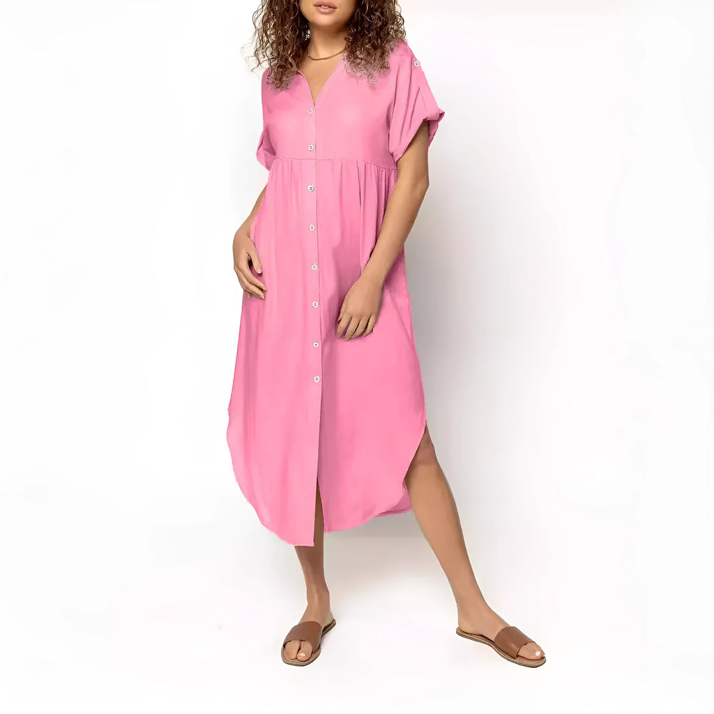 A loose fit, solid colour midi dress with a button front detail, shown in one of eight available colour options.
