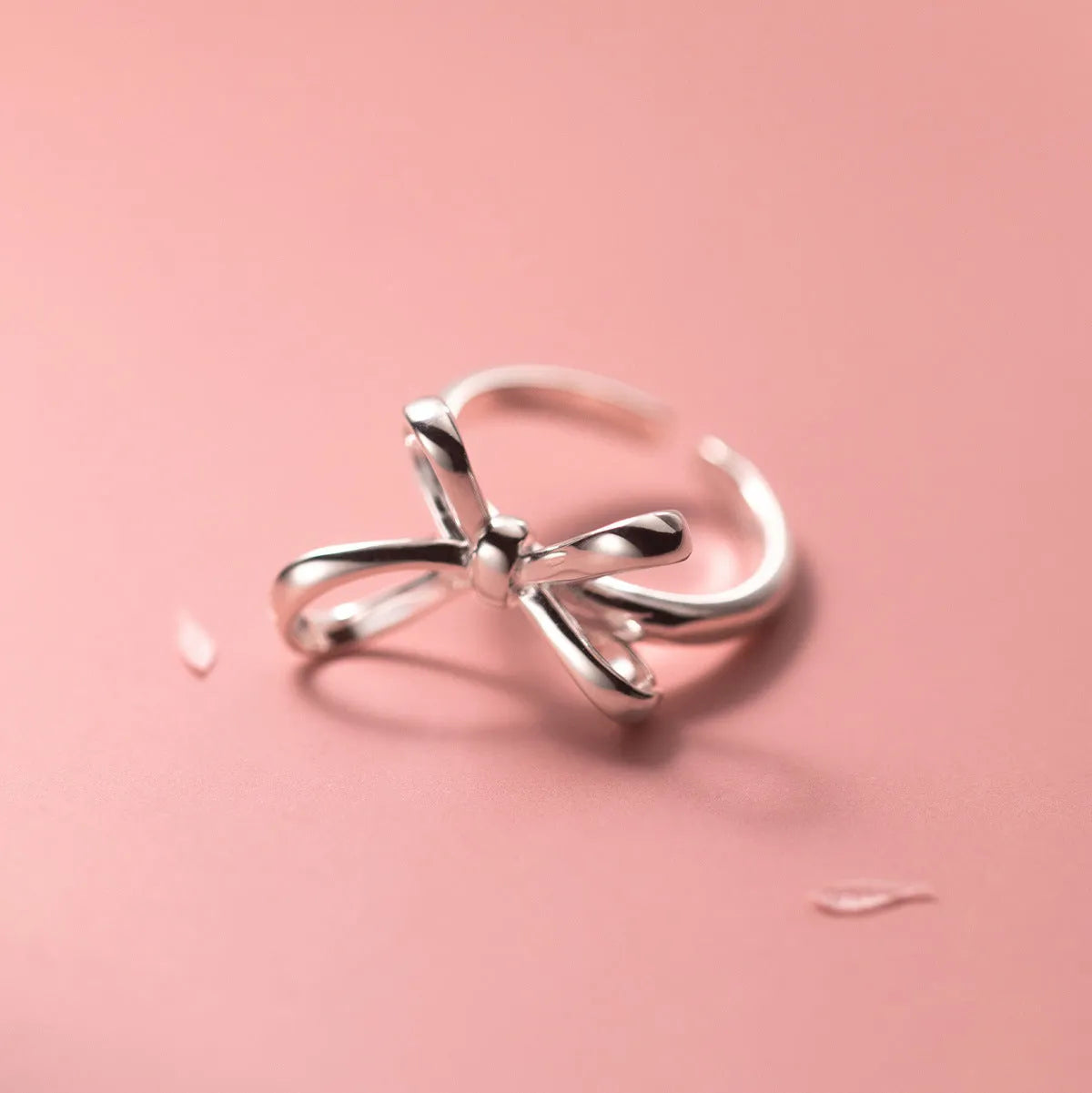 S925 silver bow ring with adjustable open band on hand, showing polished finish and Korean style design