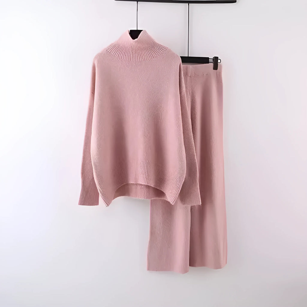 Women's milky white acrylic knit sweater and wide-leg trouser two-piece set on a hanger.
