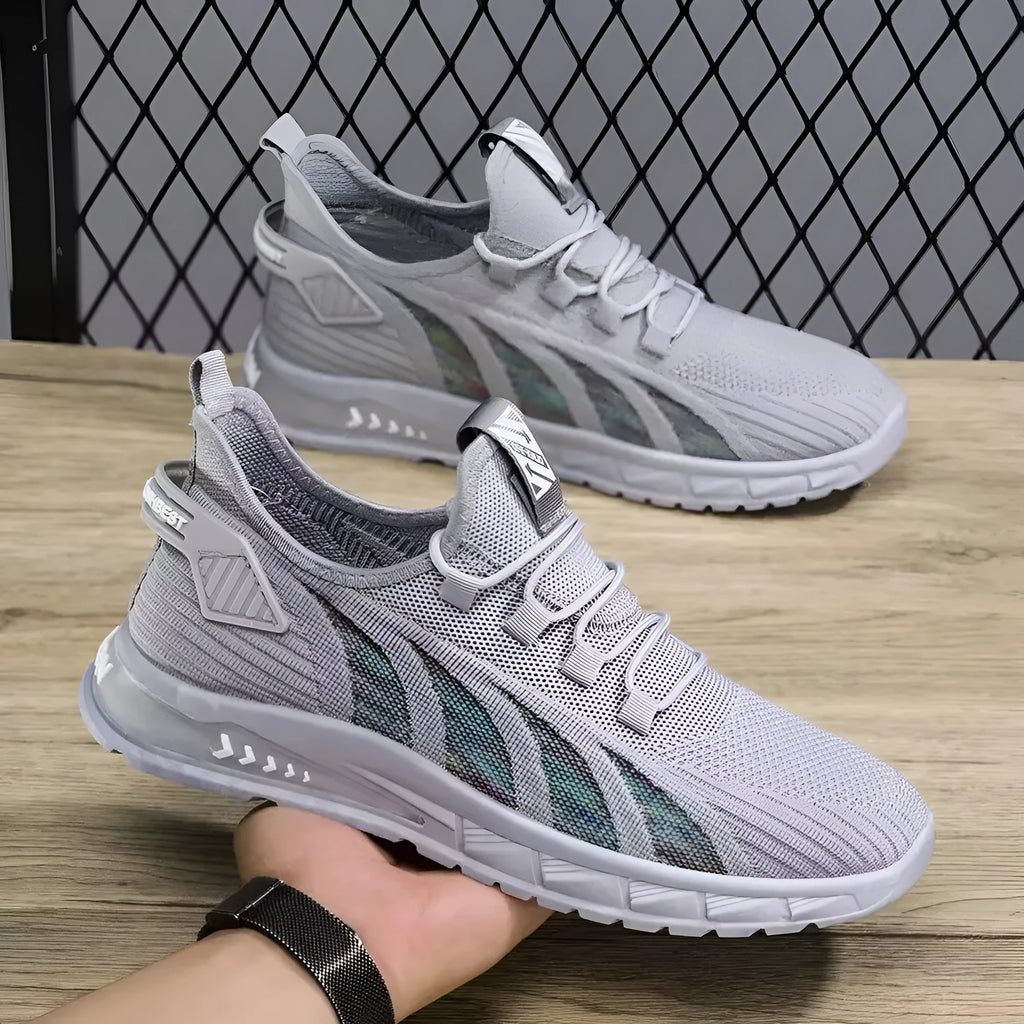 Low-top mesh sneaker in neutral colour with flat plastic sole, shown in student leisure style.