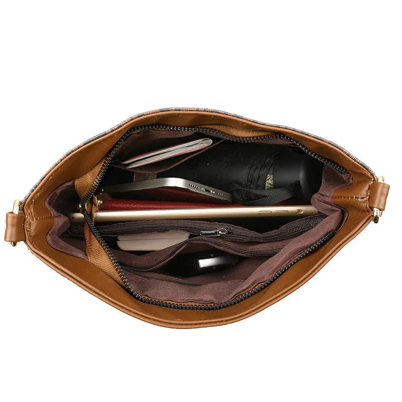 Brown soft PU leather messenger bag with external pocket and organised interior compartments.