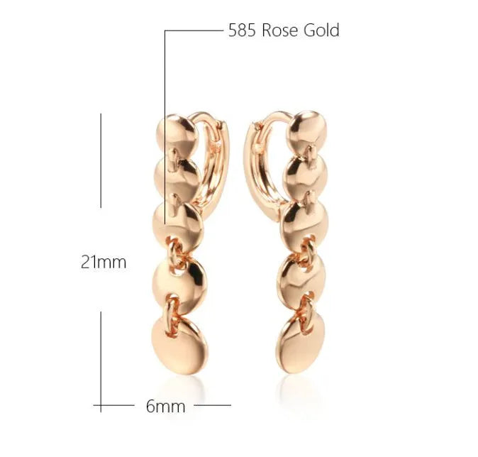 A pair of gold-coloured retro long round circle earrings with a woven copper design.