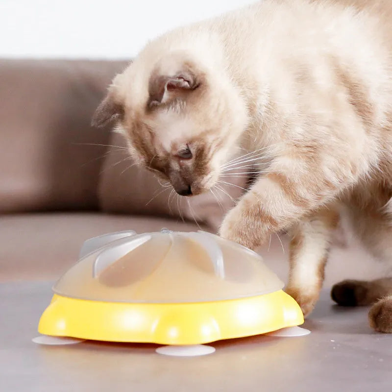 Yellow educational cat toy with treat dispensing and snack storage functions