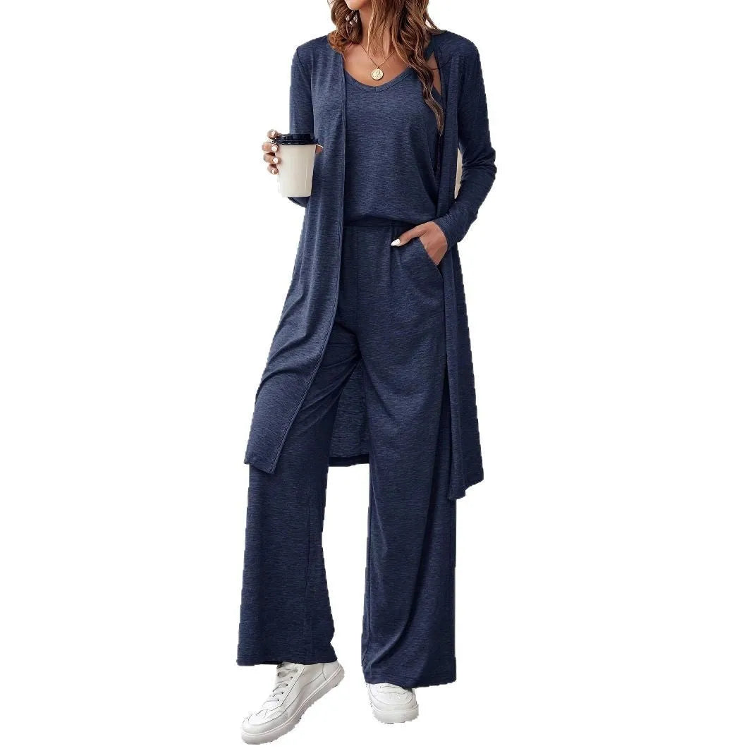Blue women's three-piece casual suit set with trousers, top, cardigan, and suspenders laid flat.