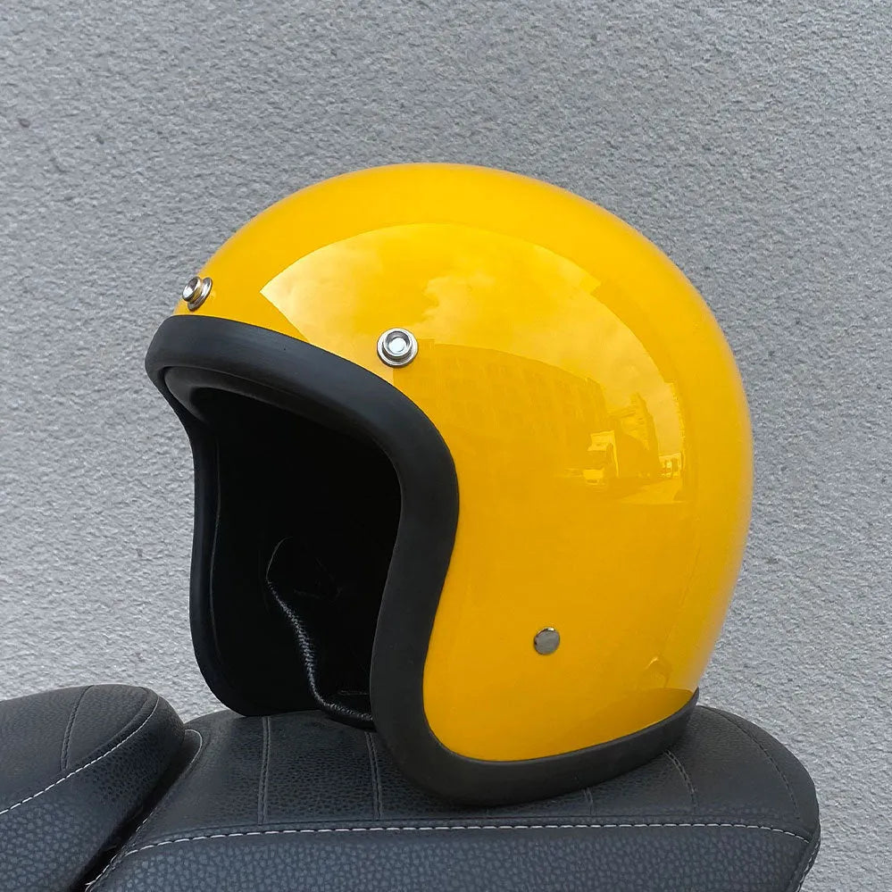 Retro-style open-face motorcycle half helmet in cement grey with a glossy FRP shell and quick-release chin strap.
