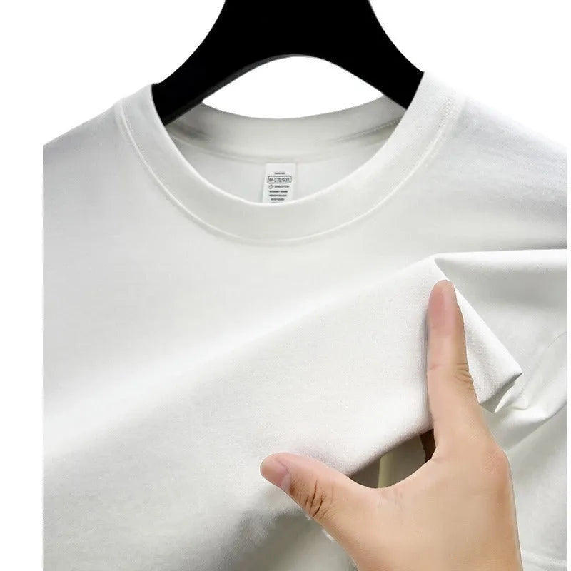 Men's solid colour cotton t-shirt with drop shoulder design on a hanger.