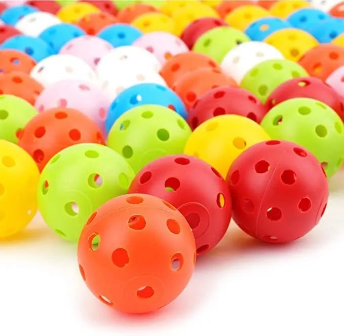 Multi-colour golf practice balls in red, orange, blue, green, white, and yellow shown in a net bag.