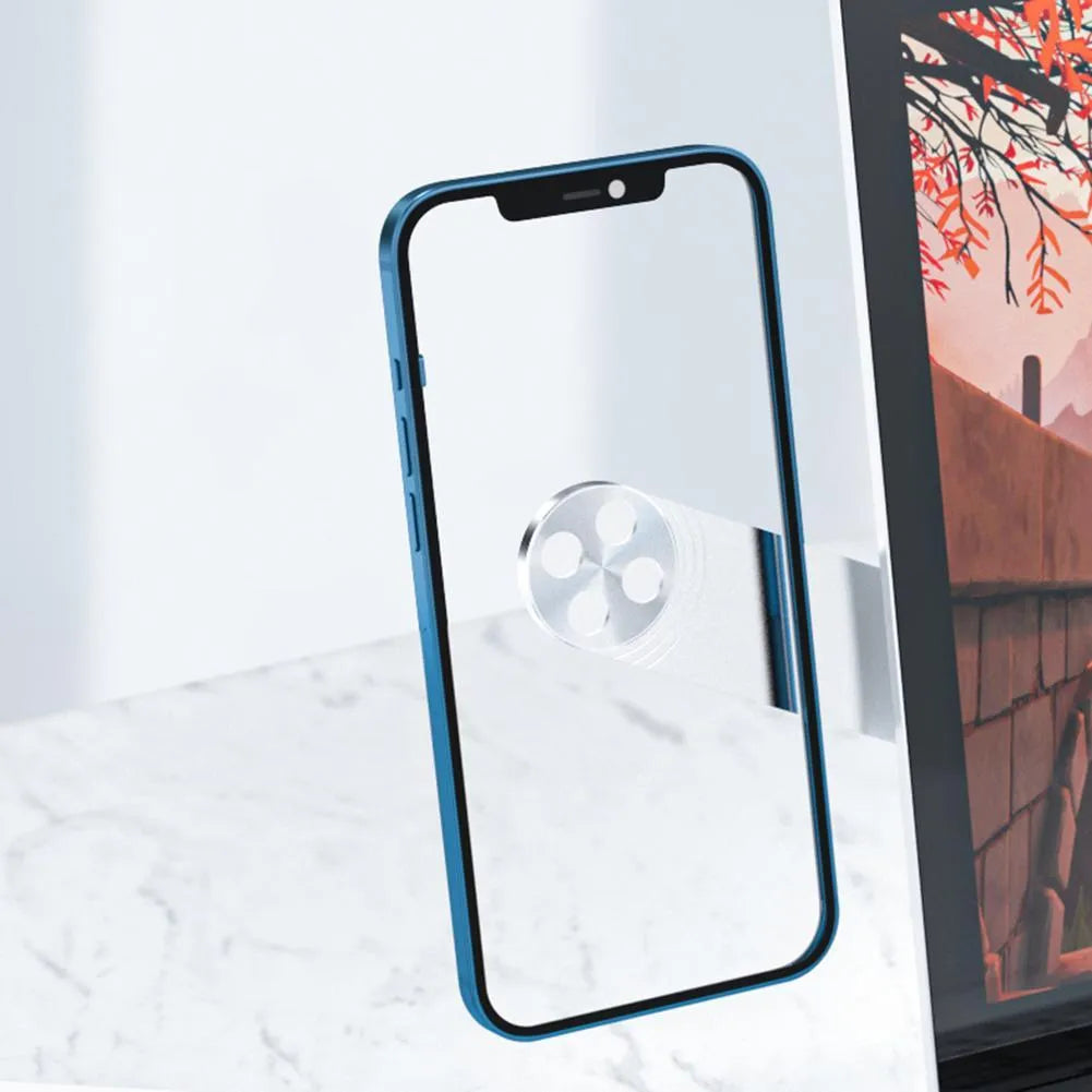 Black magnetic phone holder attached to side of silver laptop, showing phone mounted.