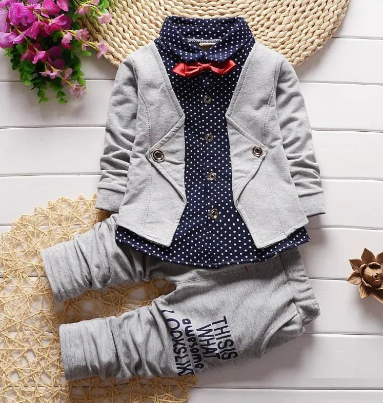 Kids blue cotton blend sport suit set with zip jacket and elasticated waist trousers on a hanger.
