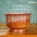 Antique carved wood burning finish on a purple sand ceramic bonsai flowerpot.