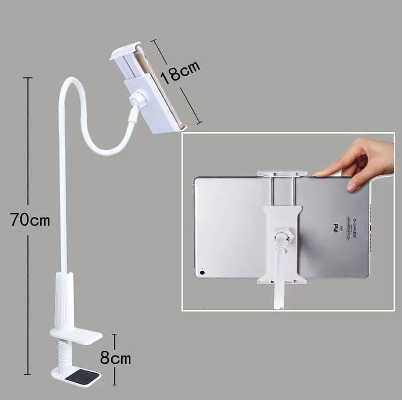 Black bedside oversize flat panel mobile phone stand with a long arm on a wooden table.