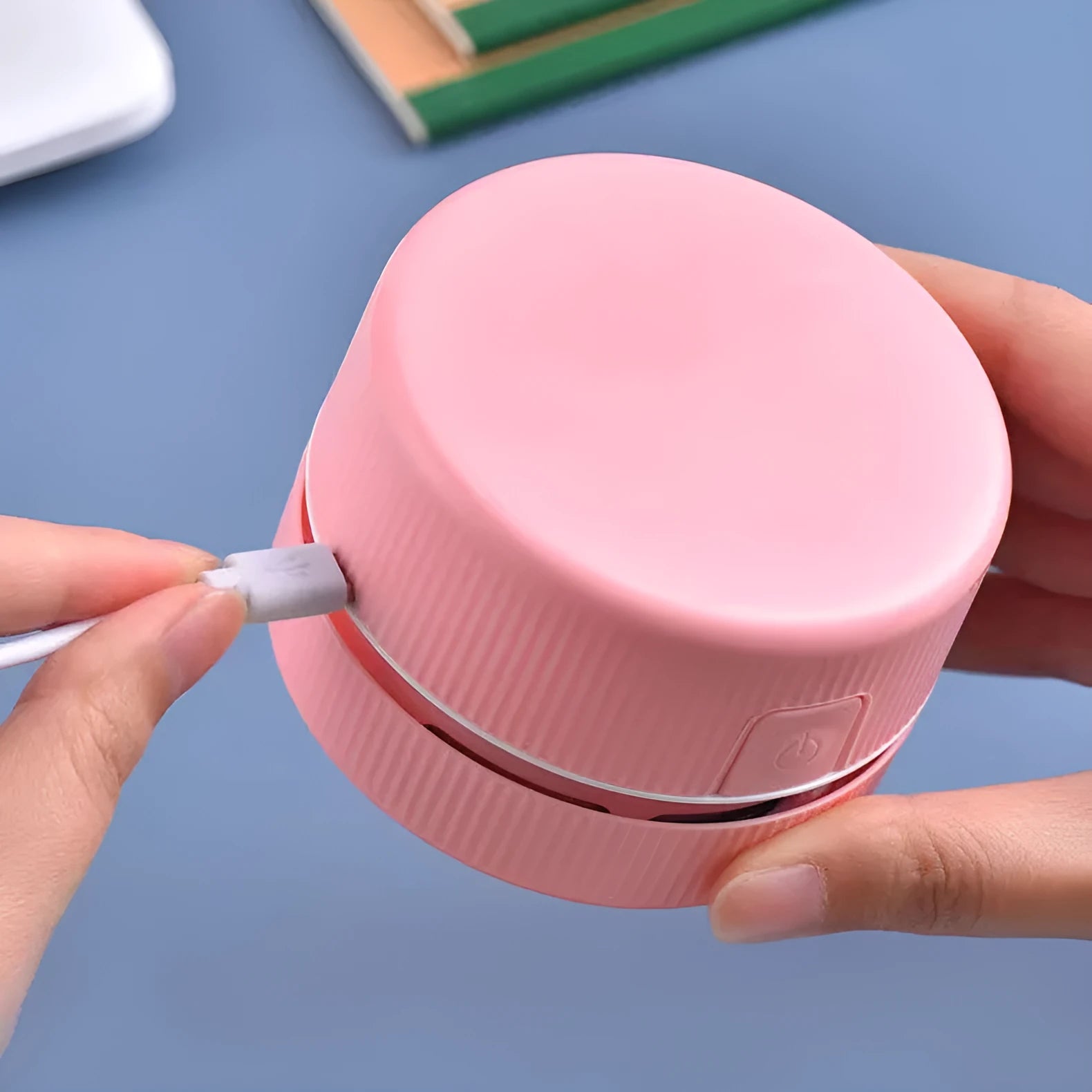 Mini handheld desktop vacuum cleaner in blue colour for pencil chip and soot removal