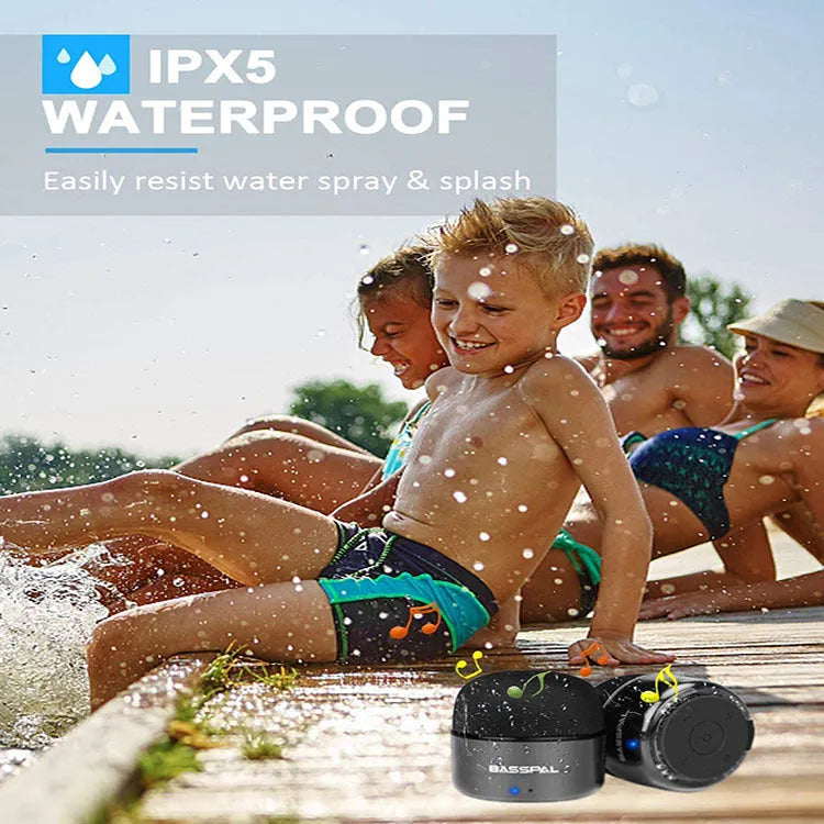 Black plastic portable mini Bluetooth speaker with IPX5 waterproof rating.
