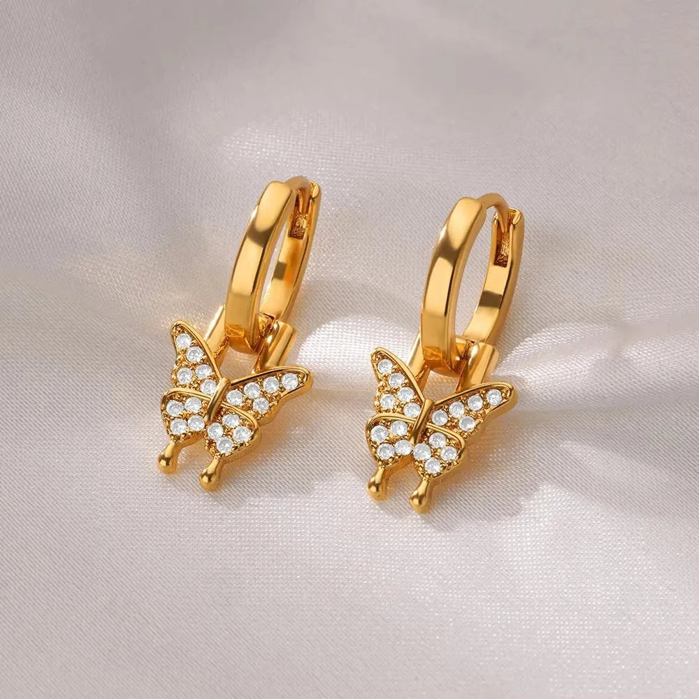Women's copper geometric butterfly earrings with heart, bow and star details