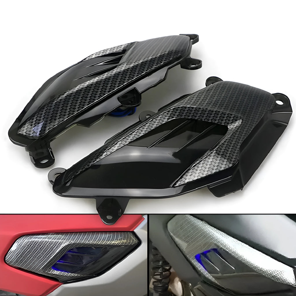 Pair of Yamaha NMAX scooter side lamp units with carbon fibre pattern and blue LED illumination