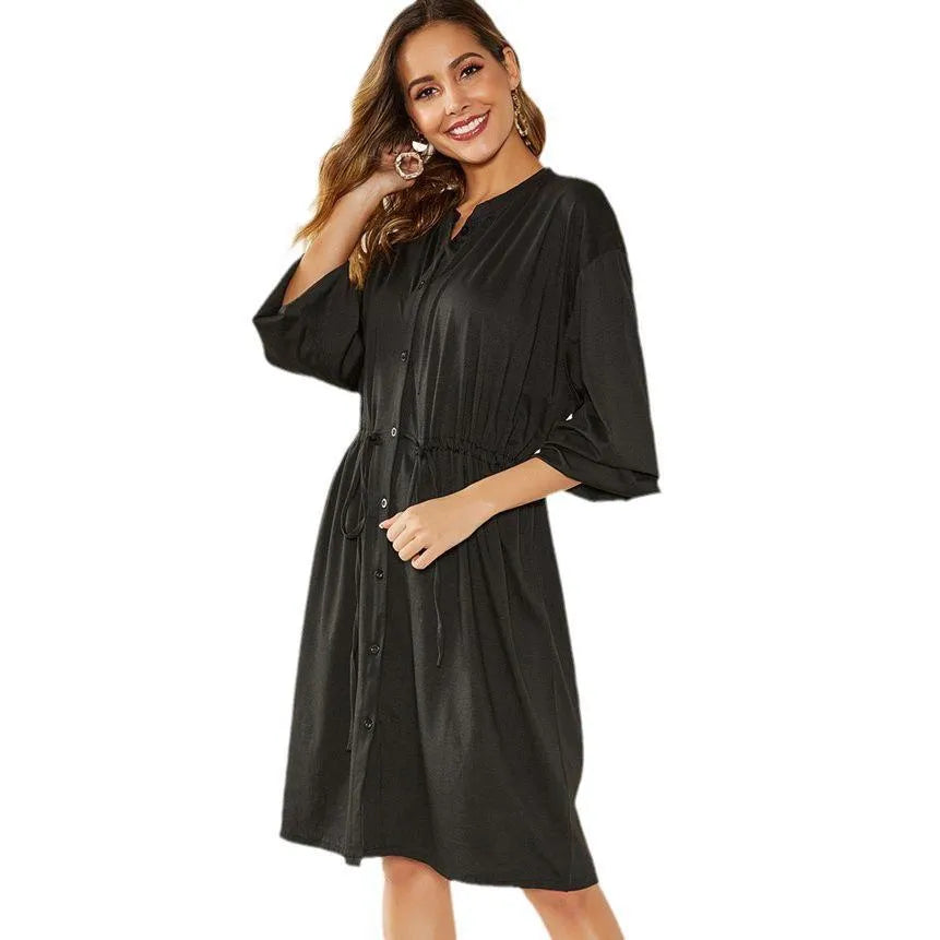 Black mid-length A-line women's dress with elastic cuffs and a cinched waist belt