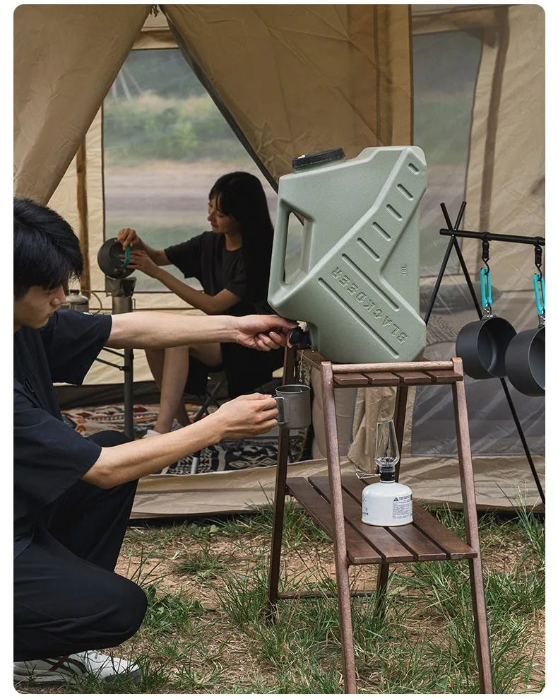 Green portable water storage tank with 13L and 18L capacity options for camping and household use