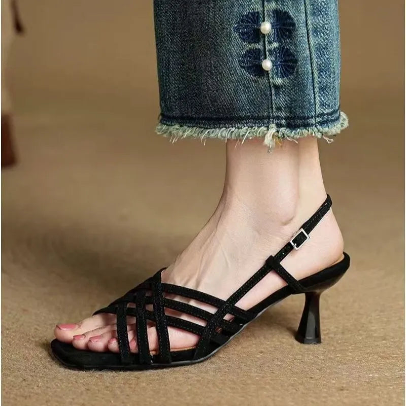 Retro women's sandals with thin brown cross straps, square toe, adjustable ankle buckle, and a block heel.