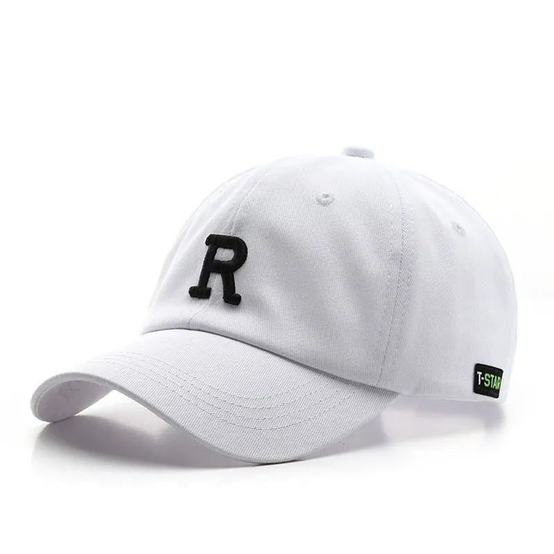 Adjustable cotton baseball cap with embroidered letter R in beige colour, dome style, unisex design