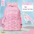 Blue children's waterproof school backpack with dinosaur pattern and curved shoulder straps.