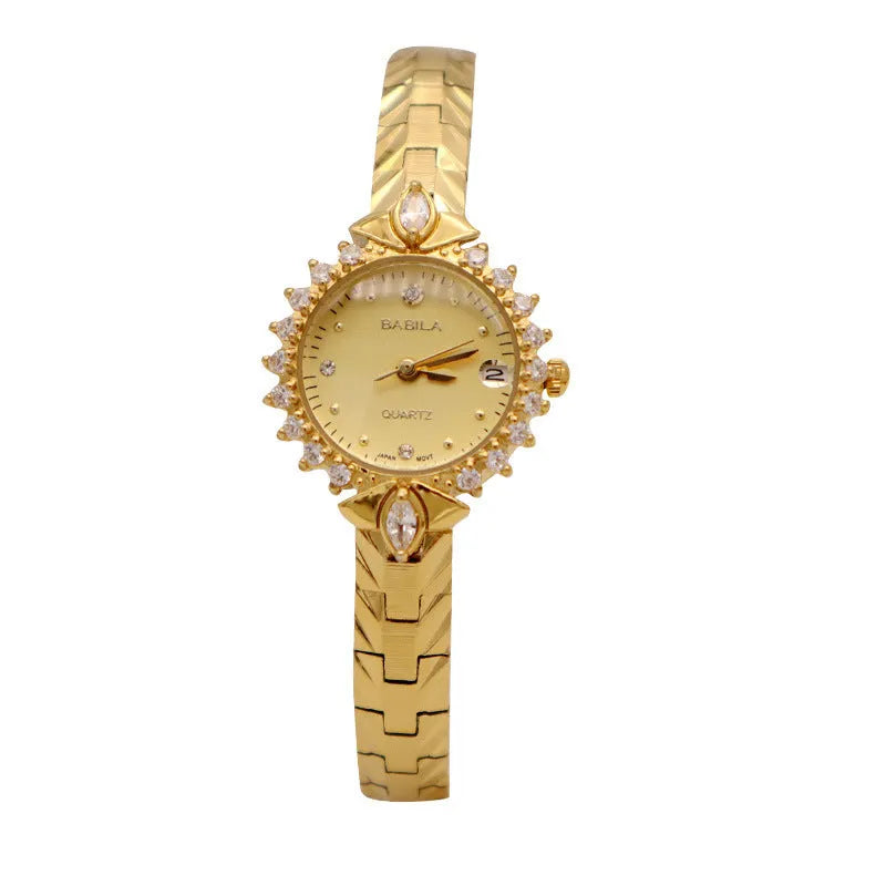 Women's gold vintage style quartz watch with diamond embossed bracelet.