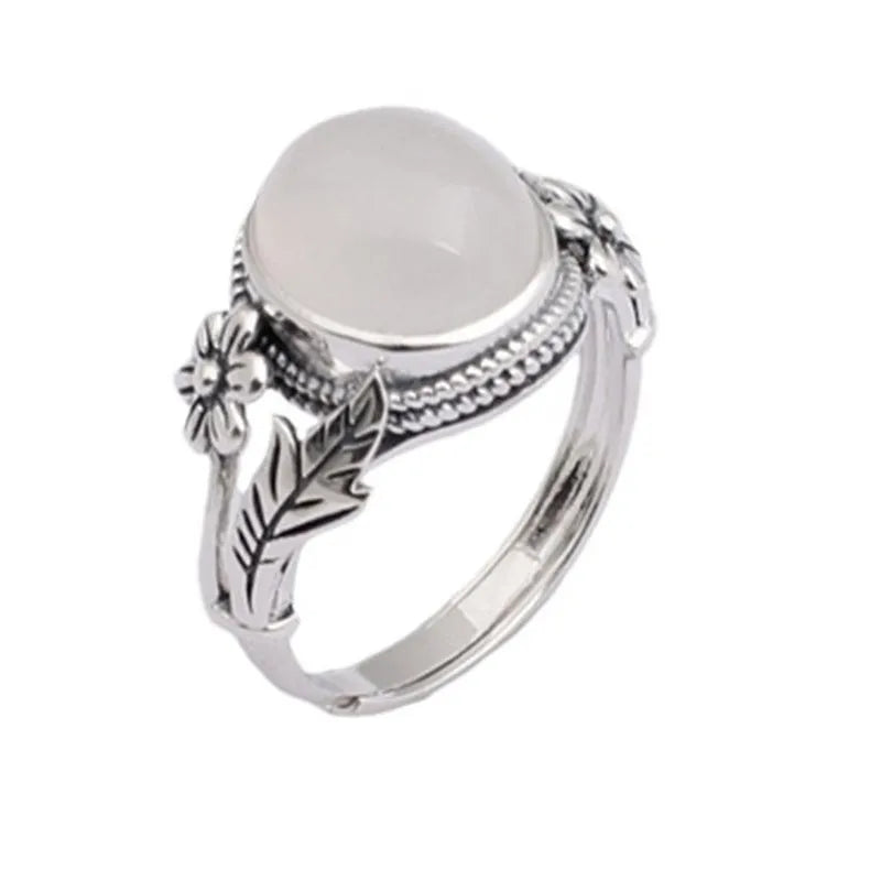 Copper vintage ring with white stone and adjustable U-shaped band.
