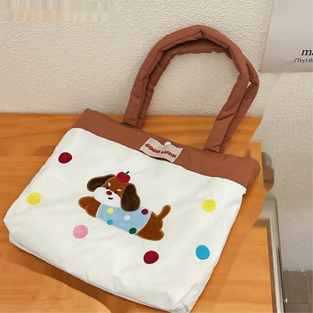 Cartoon print canvas handbag showing colourful design with 30x36x24cm dimensions