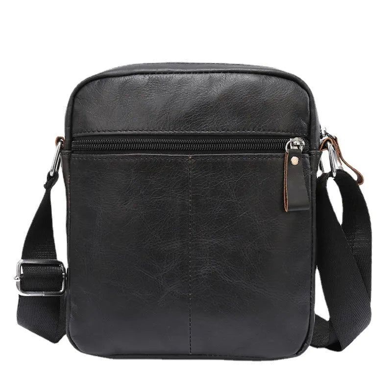 Black genuine leather crossbody messenger bag for boys with sewing line detail showing 8 inch size