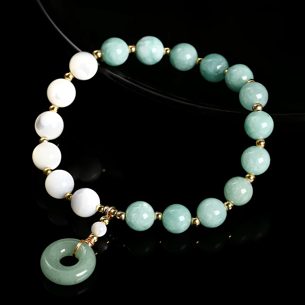 Women's Burma jade bracelet with copper horseshoe screw safety clasp showing 8mm round beads