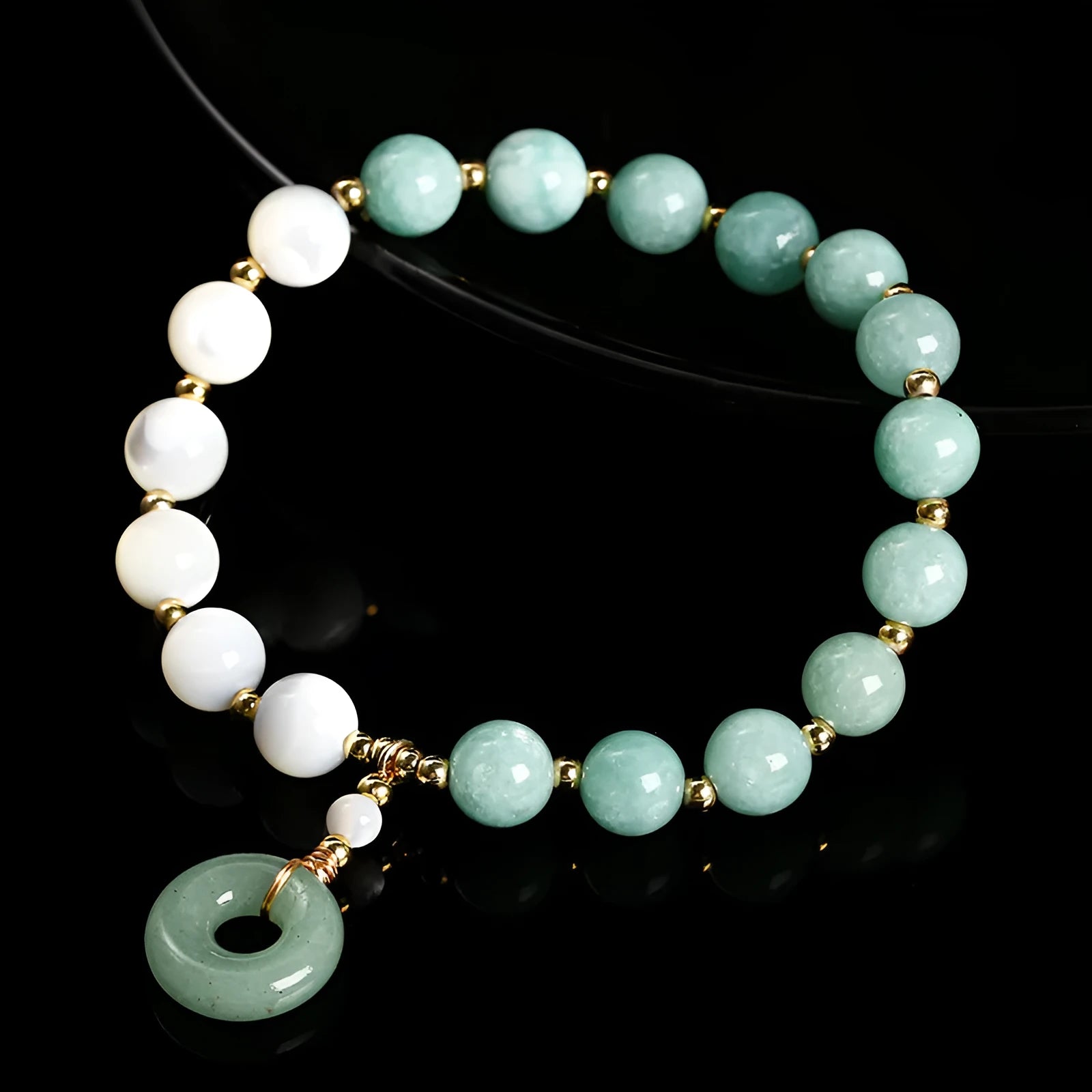 Women's Burma jade bracelet with copper horseshoe screw safety clasp showing 8mm round beads