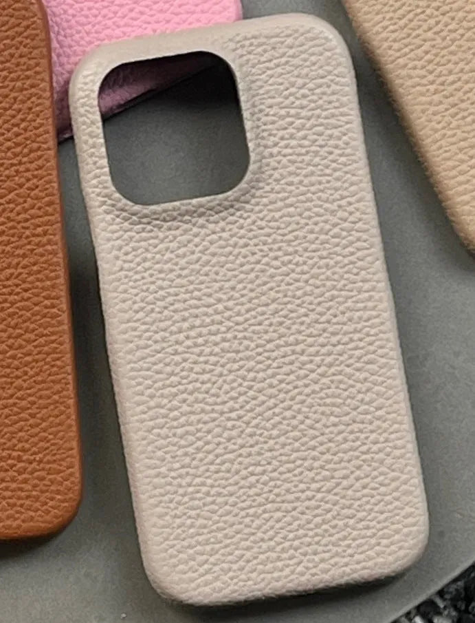 Solid colour leather phone case for iPhone in caramel shade with fall protection ins style